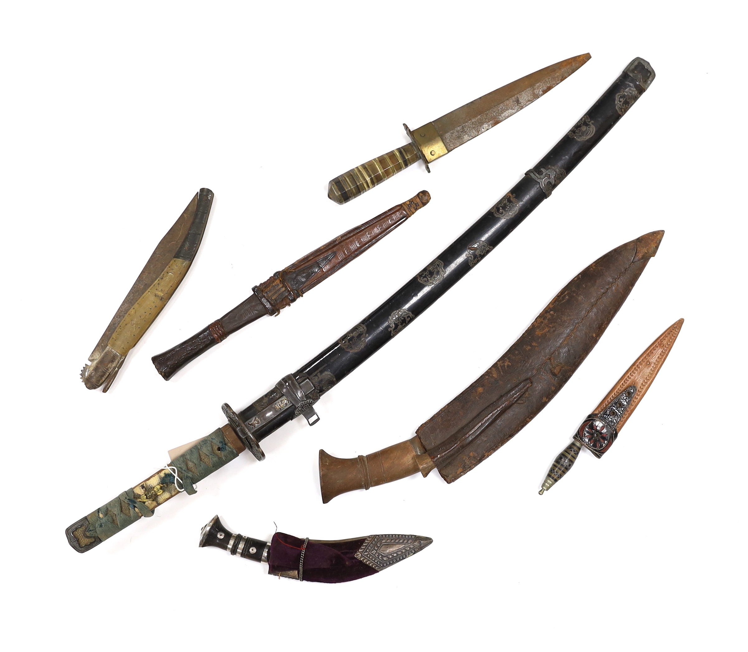 A 19th century Japanese katana with signature to the tang, with chiselled bronze tsuba and gilt metal menuki, and six various knives, blade 57cm